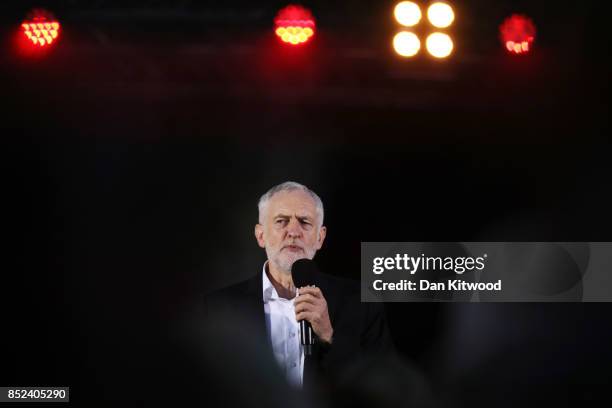 Labour Leader Jeremy Corbyn addresses supporters during a Momentum Rally on the eve of the Labour Party Conference on September 23, 2017 in Brighton,...