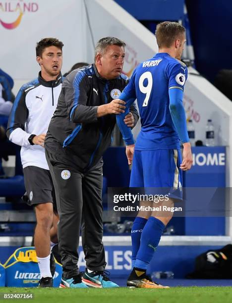 Craig Shakespeare, manager of Leicester City speaks to Jamie Vardy of Leicester City during the Premier League match between Leicester City and...