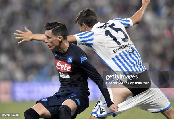 Naples' Spanish forward Jose Callejon pulls the shorts of Spal's Finnish defender Sauli Vaisanen during the Serie A football match between Spal and...