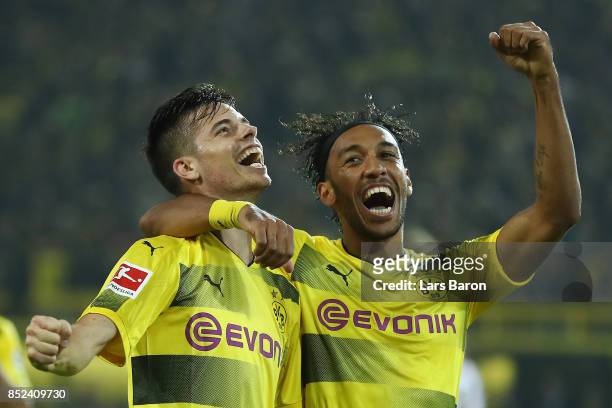 Julian Weigl of Dortmund celebrates with Pierre-Emerick Aubameyang of Dortmund after he scored his teams sixth goal to make it 6:1 during the...