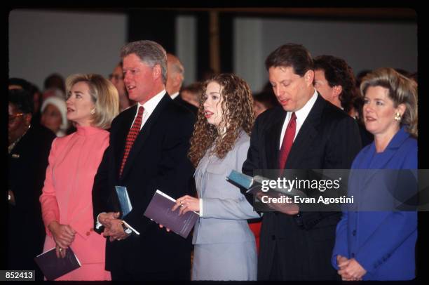 President Bill Clinton sings hymns with wife Hillary, daughter Chelsea, and Al and Tipper Gore at the Metropolitan African Methodist Episcopal Church...