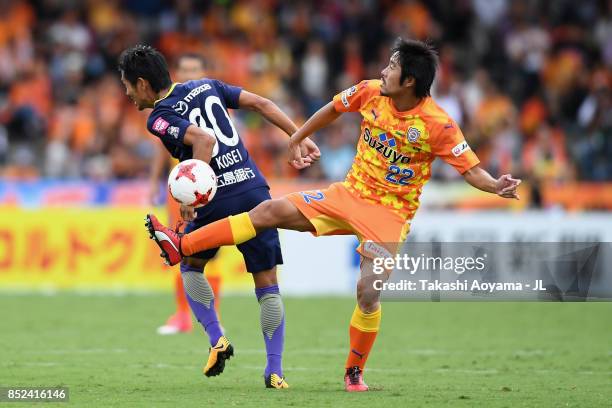 Takuma Edamura of Shimizu S-Pulse and Kosei Shibasaki of Sanfrecce Hiroshima compete for the ball during the J.League J1 match between Shimizu...