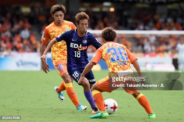 Yoshifumi Kashiwa of Sanfrecce Hiroshima takes on Shota Kaneko of Shimizu S-Pulse during the J.League J1 match between Shimizu S-Pulse and Sanfrecce...