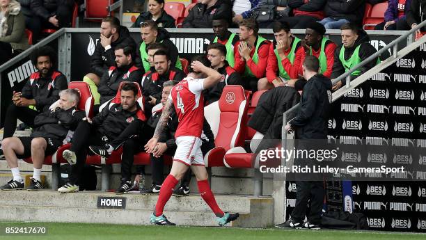 Fleetwood Town's Aiden O'Neill looks dejected as he leaves the pitch after being shown a red card during the Sky Bet League One match between...