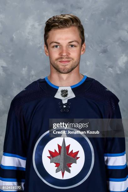 Josh Morrissey of the Winnipeg Jets poses for his official headshot for the 2017-2018 season on September 14, 2017 at the Bell MTS Iceplex in...
