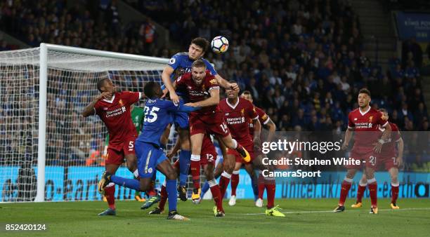 Liverpool's Jordan Henderson defends against Leicester City's Harry Maguire during the Premier League match between Leicester City and Liverpool at...