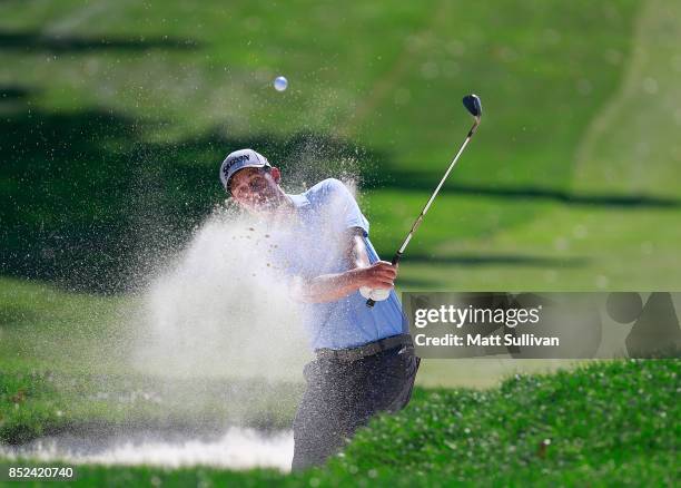 Andrew Putnam hits from a bunker on the first hole during the third round of the Web.com Tour DAP Championship on September 23, 2017 in Beachwood,...