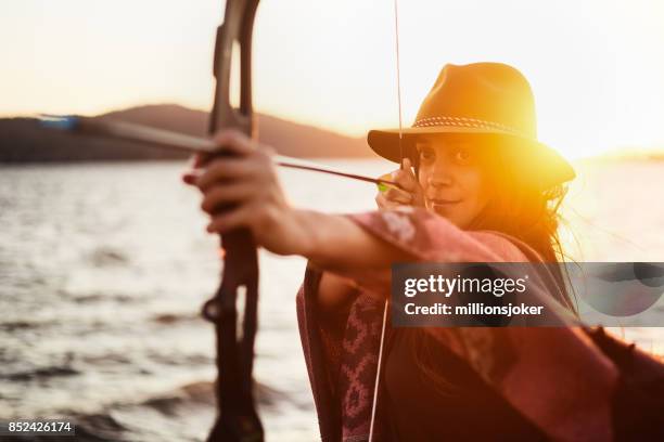 archery with sunset - the archer stock pictures, royalty-free photos & images