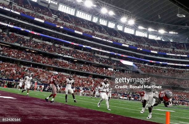 David Williams of the Arkansas Razorbacks makes a pass reception in the third quarter against the Texas A&M Aggies at AT&T Stadium on September 23,...