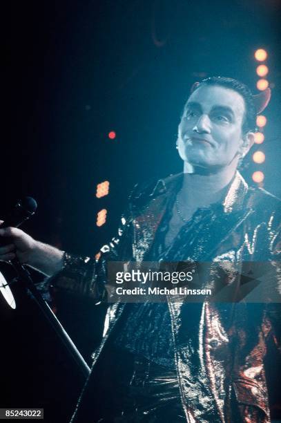 Photo of U2 and BONO, Bono performing live onstage on Zoo TV tour, dressed as Mister Macphisto character, with devil horns