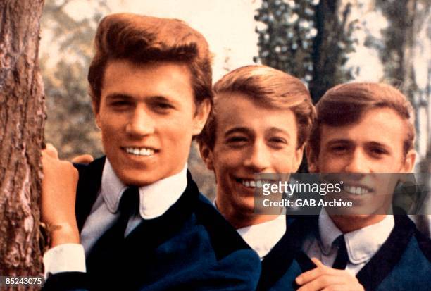 Photo of BEE GEES posed in 1964. Left to right: Barry Gibb, Robin Gibb and Maurice Gibb.