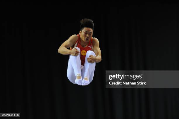 Tan Haofeng of China competes on the trampoline during the Trampoline, Tumbling & DMT British Championships at the Echo Arena on September 23, 2017...