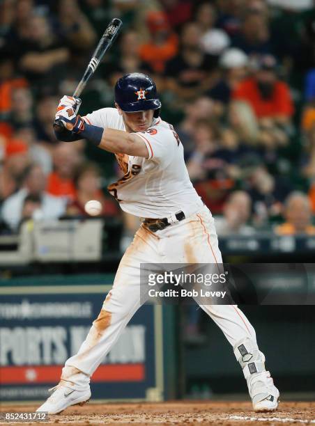 Alex Bregman of the Houston Astros is hit by a pitch in the fifth inning against the Los Angeles Angels of Anaheim at Minute Maid Park on September...