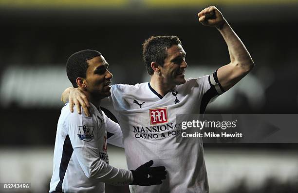 Robbie Keane of Tottenham Hotspur celebrates Aaron Lennon's second goal during the Barclays Premier League match between Tottenham Hotspur and...