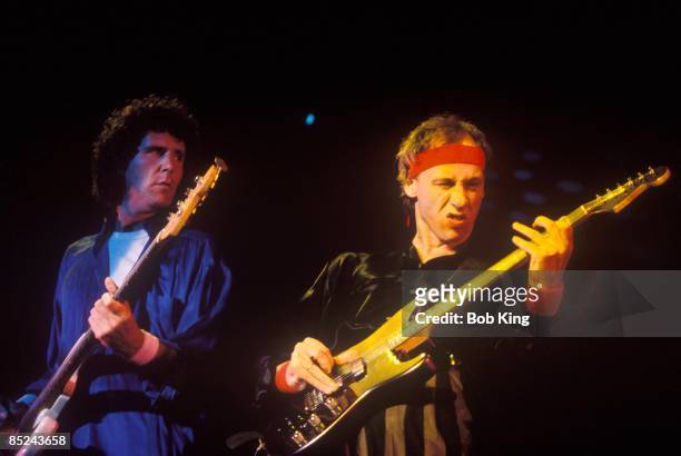 Photo of DIRE STRAITS and John ILLSLEY and Mark KNOPFLER; L-R: John Illsley, Mark Knopfler performing live onstage