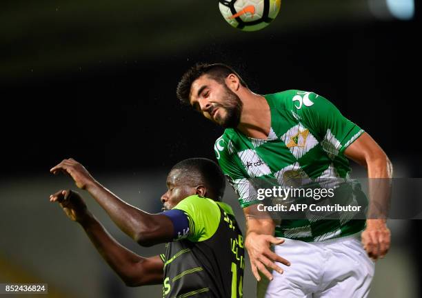 Moreirense's defender Andre Micael heads the ball with Sporting's midfielder William Carvalho during the Portuguese league football match Moreirense...