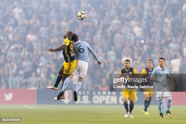 Bradley Wright-Phillips of New York Red Bulls and Ilie Sanchez of Sporting Kansas City challenge for the ball in the US Open Cup Final match at...