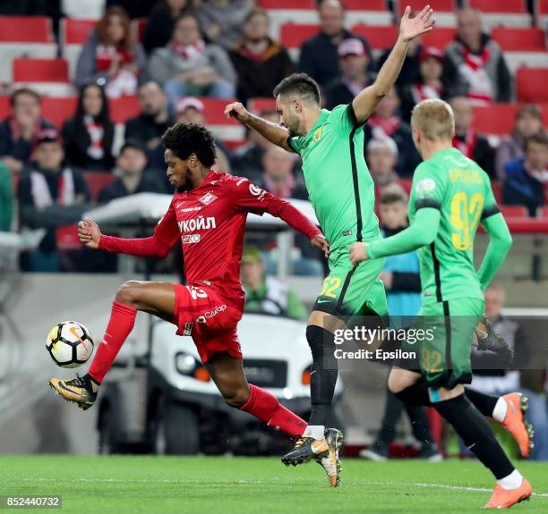 Luiz Adriano of FC Spartak Moscow vies for the ball with Miral Samardzic of FC Anzhi Makhachkala during the Russian Premier League match between FC...