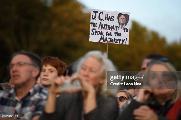 Supporter holds up a placard as they listen to a speech by Labour Party leader Jeremy Corbyn at a Momentum rally on September 23, 2017 in Brighton,...