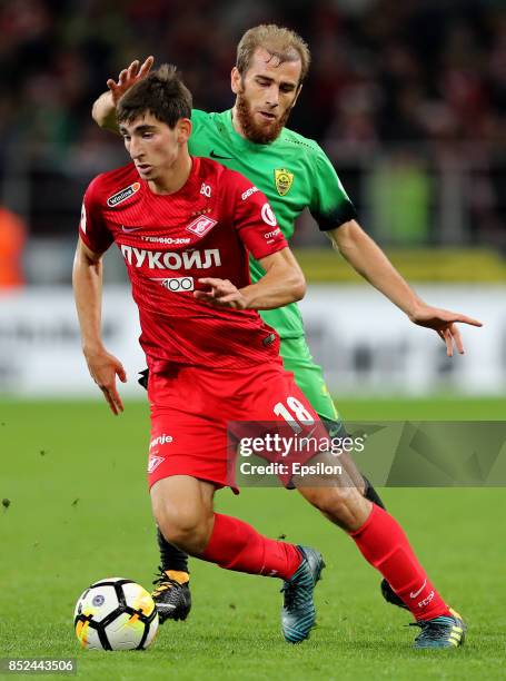 Zelimkhan Bakayev of FC Spartak Moscow vies for the ball with Adlan Katsayev of FC Anzhi Makhachkala during the Russian Premier League match between...