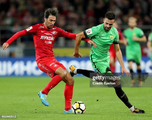 Ivelin Popov of FC Spartak Moscow vies for the ball with Miral Samardzic of FC Anzhi Makhachkala during the Russian Premier League match between FC...