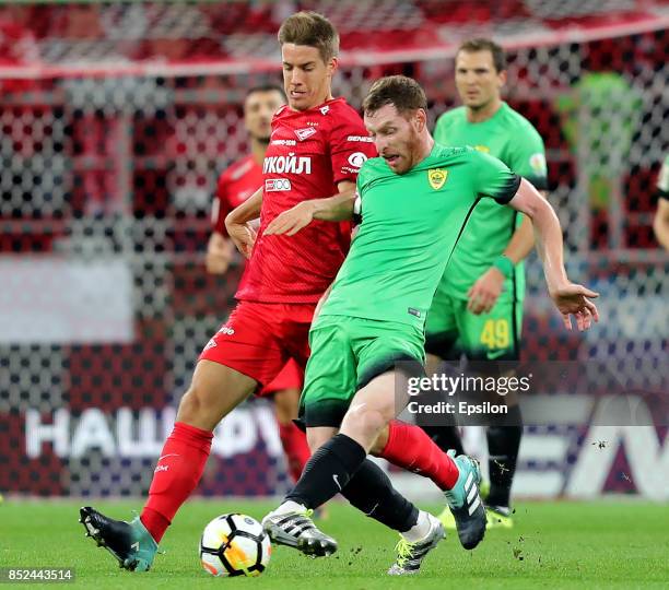 Mario Pasali of FC Spartak Moscow vies for the ball with Guram Tetrashvili of FC Anzhi Makhachkala during the Russian Premier League match between FC...