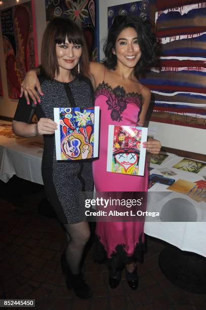 Actresses Mary Christina Brown and Vanessa E. Garcia attend the Vanessa E. Garcia's Art Show with partial proceeds going to House of Ruth based in...