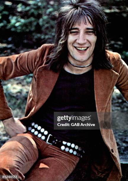 Photo of FACES and Rod STEWART; posed, Faces era, wearing studded belt