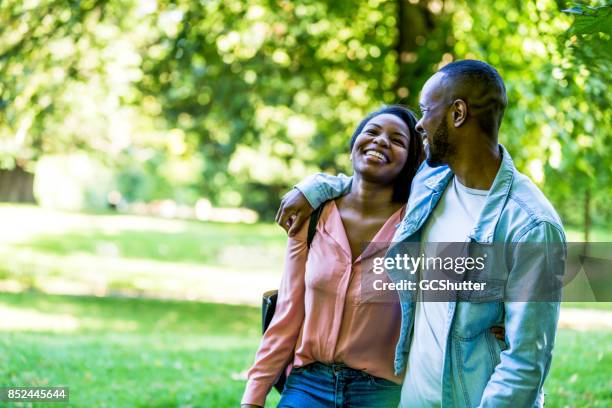 ending the date with a tour of the park - couple walking in park stock pictures, royalty-free photos & images