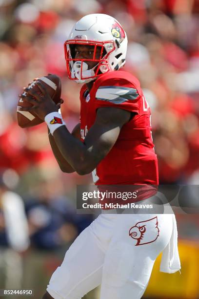 Lamar Jackson of the Louisville Cardinals looks to pass against the Kent State Golden Flashes during the first half at Papa John's Cardinal Stadium...