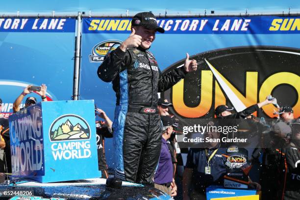 Christopher Bell, driver of the SiriusXM Toyota, celebrates in Victory Lane after winning the NASCAR Camping World Truck Series UNOH 175 at New...