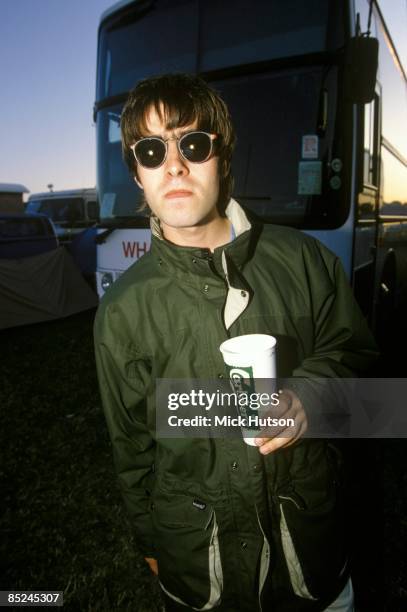 Photo of Liam GALLAGHER and OASIS, Liam Gallagher, posed, backstage, holding beer