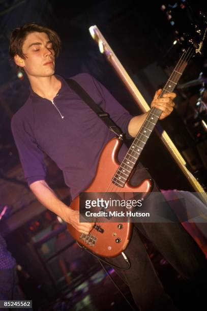 Photo of Alex JAMES and BLUR, Alex James performing live onstage, playing Fender Precision bass guitar