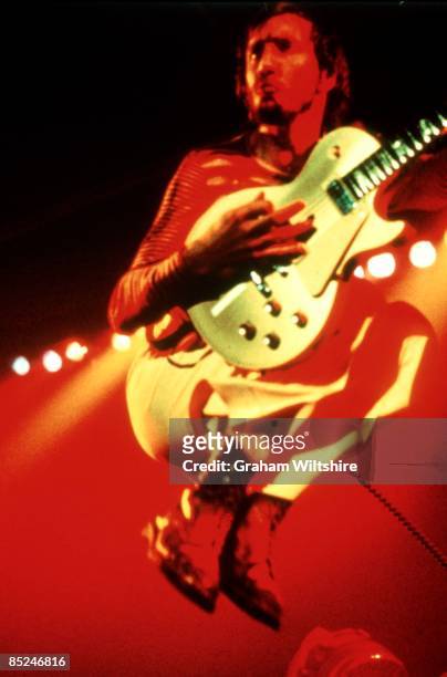 Photo of Pete TOWNSHEND and The Who, Pete Townshend performing live onstage, playing Gibson Les Paul guitar, jumping