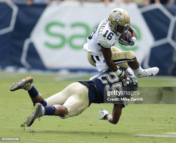 Quarterback TaQuon Marshall of the Georgia Tech Yellow Jackets is tackled by linebacker Elijah Zeise of the Pittsburgh Panthers at Bobby Dodd Stadium...