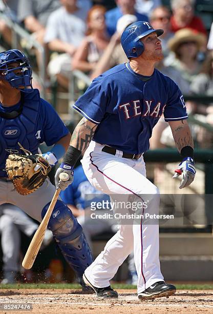 Josh Hamilton of the Texas Rangers bats against the Kansas City Royals during the spring training game at Surprise Stadium on March 4, 2009 in...
