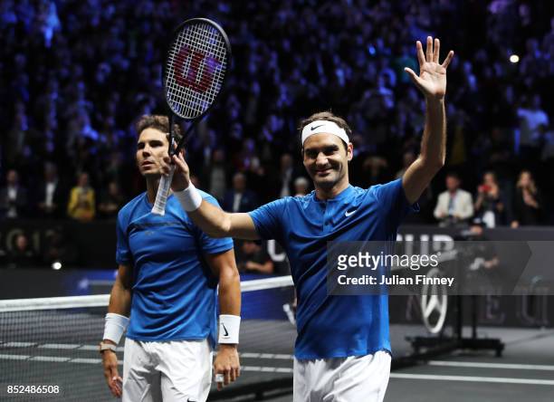 Roger Federer and Rafael Nadal of Team Europe celebrate after winning there doubles match against Jack Sock and Sam Querrey of Team World on Day 2 of...