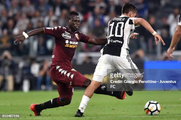 Paulo Dybala of Juventus and Afriyie Acquah of Torino during the Serie A match between Juventus and Torino FC on September 23, 2017 in Turin, Italy.