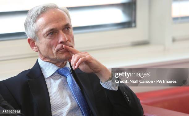 Minister for Jobs, Enterprise and Innovation Richard Bruton, listen as Qualtrics co-founder chief executive Ryan Smith speaks, during the company's...