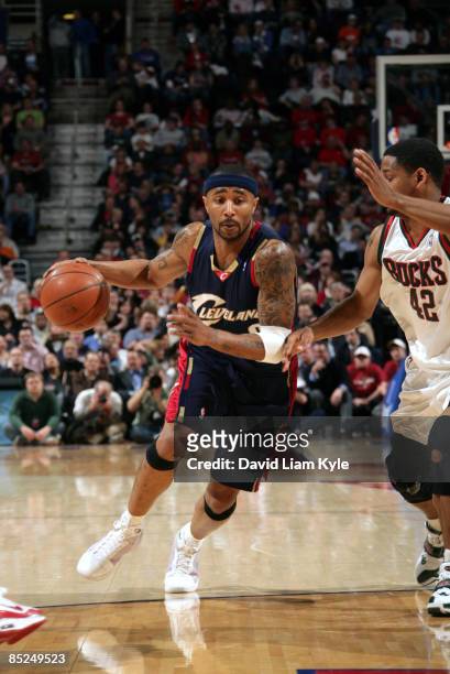 Mo Williams of the Cleveland Cavaliers drives to the basket against Charlie Bell of the Milwaukee Bucks at the Quicken Loans Arena March 22, 2009 in...