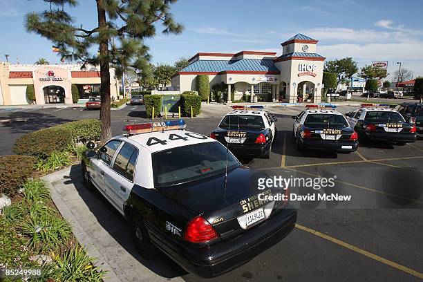 Los Angeles County Sheriff's cars are ever-present at businesses and malls throughout the city March 3, 2009 in Compton, California. The city that...
