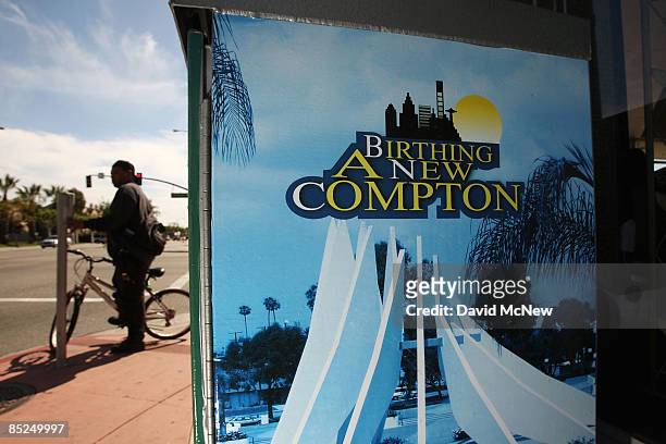 Bicyclist passes an electrical box painted to encourage community pride, March 3, 2009 in Compton, California. The city that became known as the...