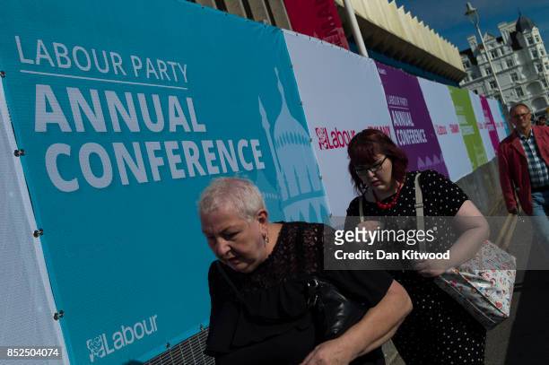 People walk past the conference centre on September 23, 2017 in Brighton, England. The annual Labour Party conference is set to start tomorrow,...