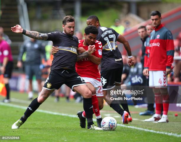 Chris Maguire of Bury holds of Charlton Athletic's Jay Dasilva during Sky Bet League One match between Charlton Athletic against Bury at The Valley...