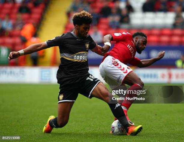 Charlton Athletic's Tarique Fosu holds of Josh Laurent of Bury during Sky Bet League One match between Charlton Athletic against Bury at The Valley...