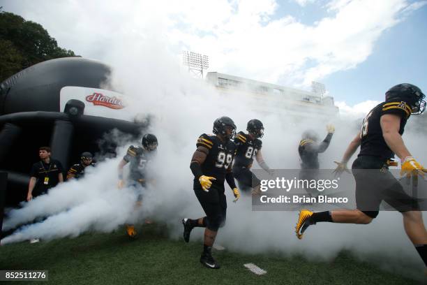 The Appalachian State Mountaineers take to the field at the start of an NCAA football game against the Wake Forest Demon Deacons on September 23,...