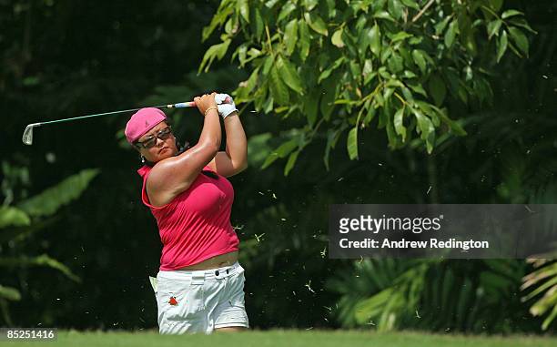 Christina Kim of the USA hits a shot from the rough on the fifth hole during the first round of the HSBC Women's Champions at Tanah Merah Country...