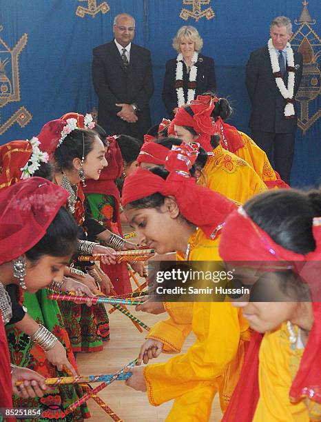 Prince Charles, Prince of Wales and Camilla, Duchess of Cornwall watch a dance performance to celebrate the Hindu festival of Holi during their visit...