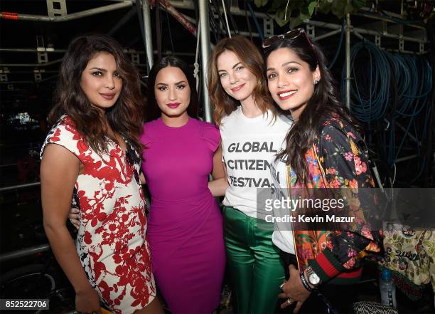 Priyanka Chopra, Demi Lovato, Michelle Monaghan and and Freida Pinto pose backstage during the 2017 Global Citizen Festival in Central Park on...