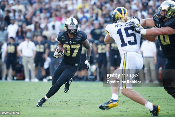 Brian Lankford-Johnson of the Purdue Boilermakers runs the ball in the second quarter of a game against the Michigan Wolverines at Ross-Ade Stadium...